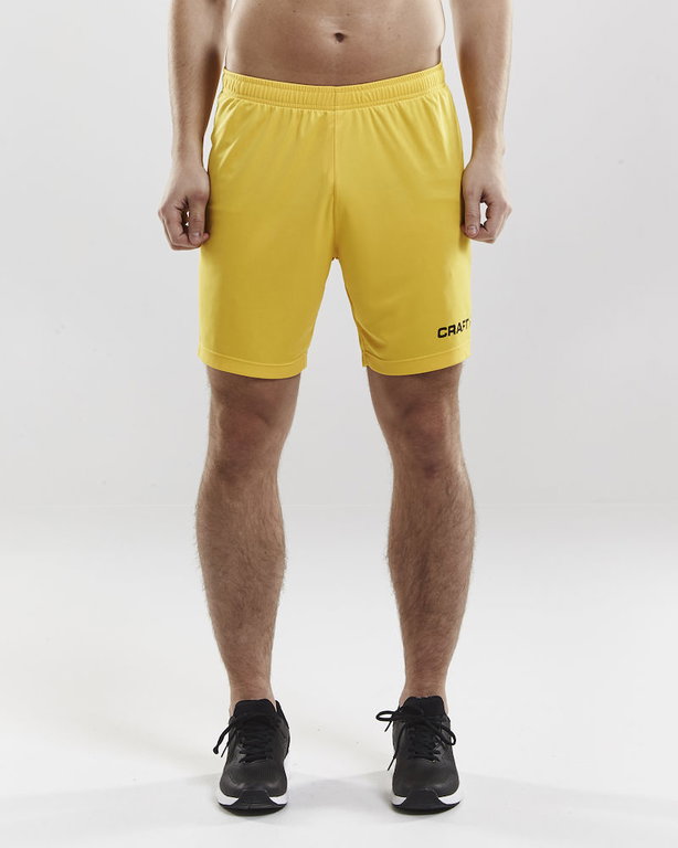 Craft Sporthose (Short) Squad Solid - ohne Innenshort, elastisches Material - gelb Herren